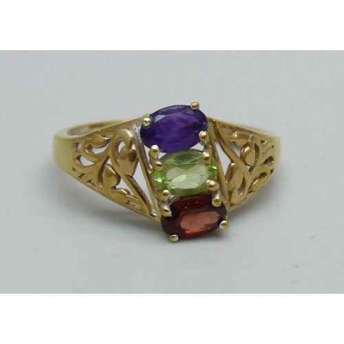 959 - A silver gilt, amethyst, garnet and peridot ring, S