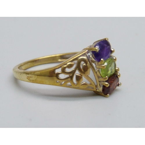 959 - A silver gilt, amethyst, garnet and peridot ring, S