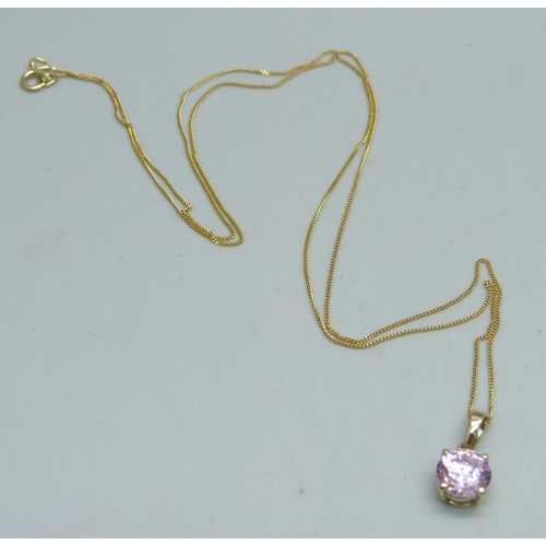 963 - A 14ct gold set pendant on a fine 14k gold chain, 1.4g, chain 44cm