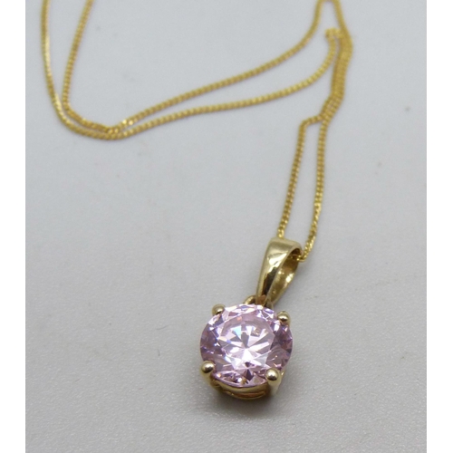 963 - A 14ct gold set pendant on a fine 14k gold chain, 1.4g, chain 44cm