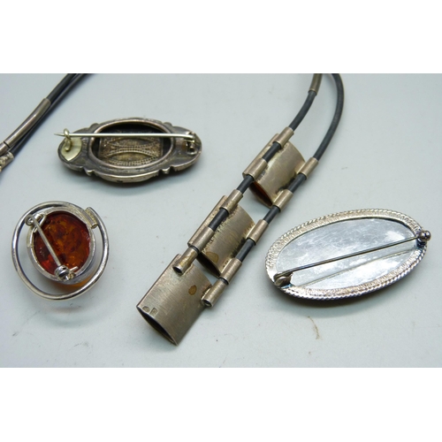 964 - A hallmarked Victorian silver brooch, a silver and Blue John brooch, an amber brooch and a silver mo... 