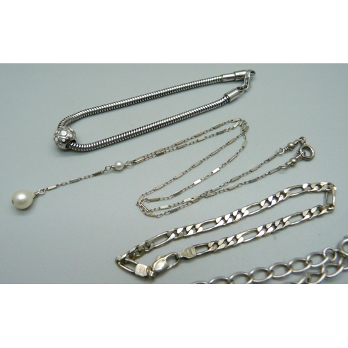 968 - A silver necklace and four silver bracelets