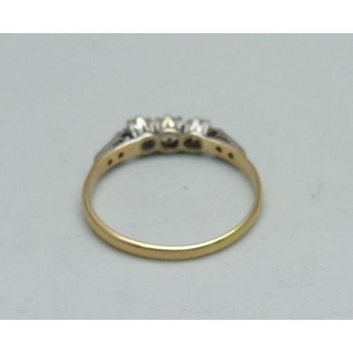 970 - An 18ct gold ring set with nine diamonds, 2.2g, T