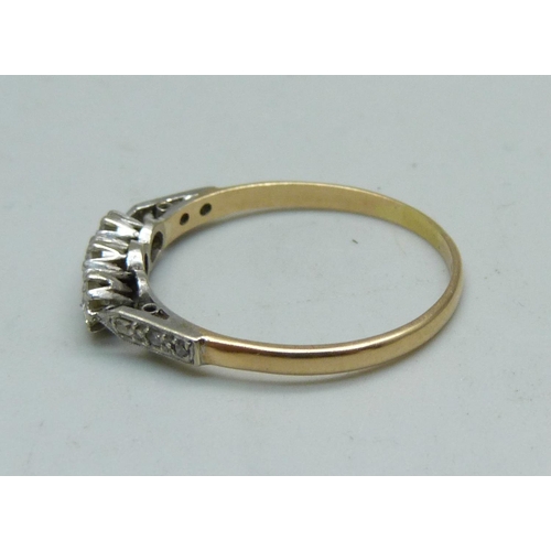 970 - An 18ct gold ring set with nine diamonds, 2.2g, T