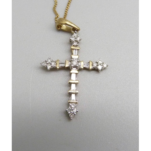 976 - A Gothic style 9ct gold and seventeen diamond cross pendant on a fine 9ct gold chain, 1.7g, chain 45... 