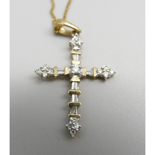 976 - A Gothic style 9ct gold and seventeen diamond cross pendant on a fine 9ct gold chain, 1.7g, chain 45... 