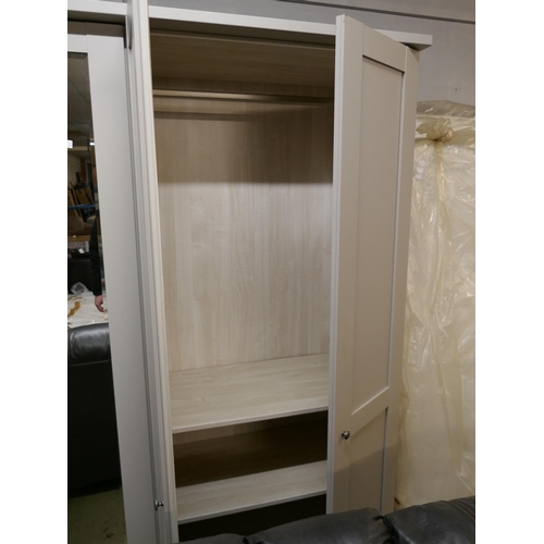 1600 - A grey and mirrored four door wardrobe* This lot is subject to VAT