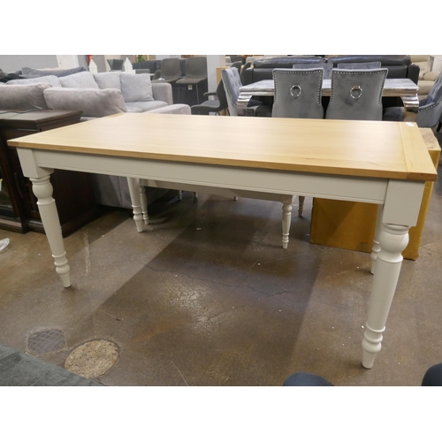 1494 - An oak dining table with white legs *This lot is subject to VAT