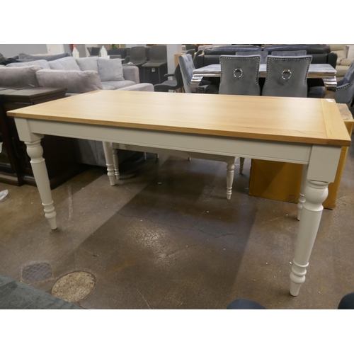 1494 - An oak dining table with white legs *This lot is subject to VAT