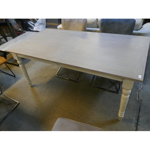 1495 - An oak and grey extending dining table *This lot is subject to VAT