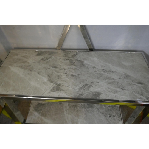 1504 - A marble and chrome shelf unit *This lot is subject to VAT