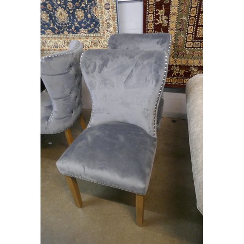 1316 - A pair of grey velvet buttoned dining chairs *This lot is subject to VAT