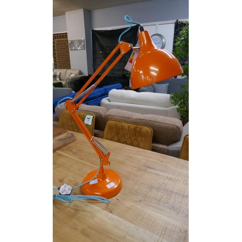 1359 - An orange angle poise lamp
