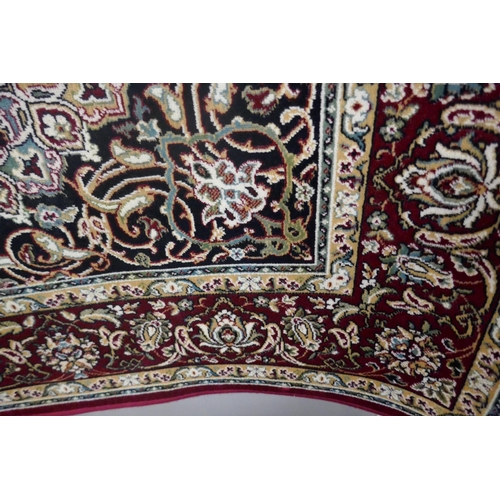 1362 - A red and ivory ground Keshan rug, 190 x 140cm