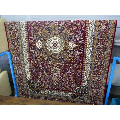 1408 - A red ground full pile Tabriz carpet, 200 x 300cm