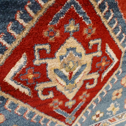 1485 - A blue full pile rug with all over medallion design, 230 x 160