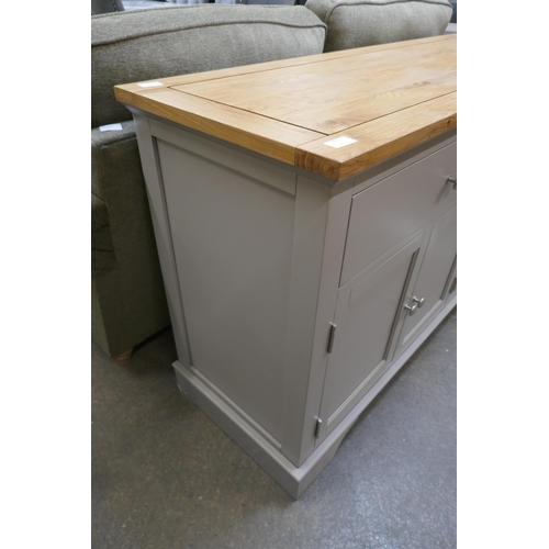 1491 - An oak and grey four door sideboard *This lot is subject to VAT