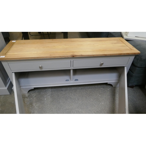 1493 - An oak and grey TV unit *This lot is subject to VAT