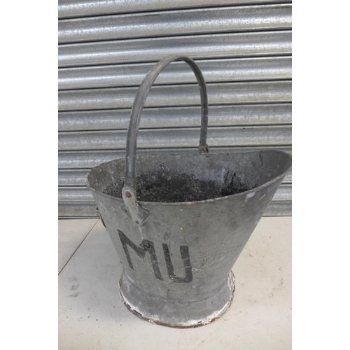 2252 - Two galvanised steel watering cans, a galvanised coal scuttle and a small cast iron bird bath