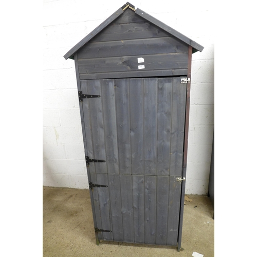 2280 - A small wooden two door storage shed with shelves