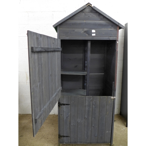 2280 - A small wooden two door storage shed with shelves