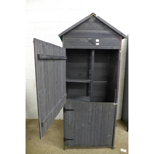 2280 - A small wooden two door storage shed with shelves