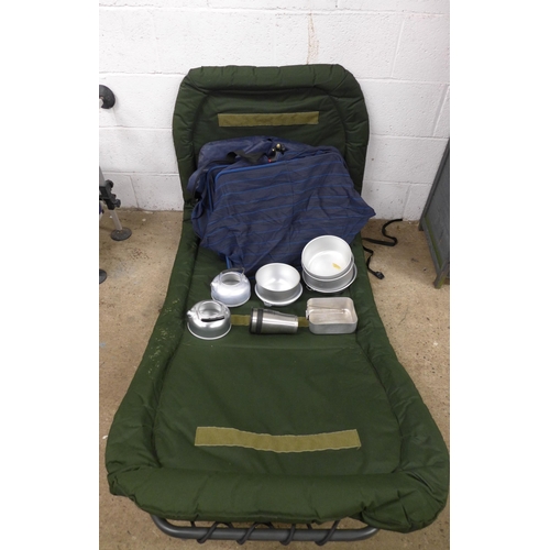 2282 - A folding fishing chair, an Ultimate keep net, camping pots and pans and a lamp