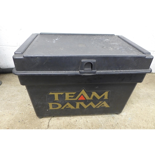 2284 - A quantity of fishing equipment including a Team Diawa fishing box containing various reels, bait bo... 