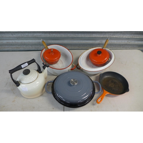 2314 - A quantity of cast iron crockery and cookware including Lavec saucepans, Crofton shallow casserole d... 