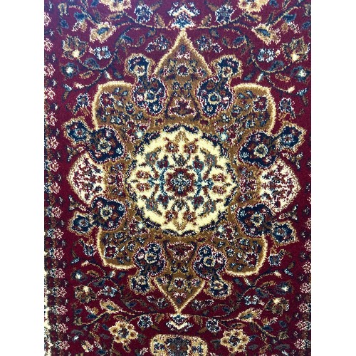 1525 - A red ground Tabriz runner with medallion design, 300 x 80cm