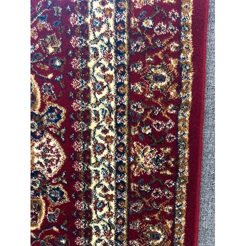 1525 - A red ground Tabriz runner with medallion design, 300 x 80cm