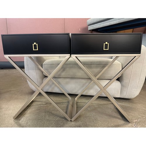 1535 - A pair of black bedside tables with silver crossed legs