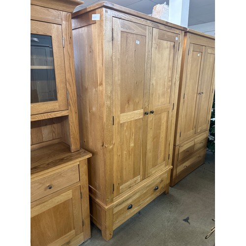 1570 - An oak double wardrobe