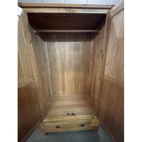 1570 - An oak double wardrobe