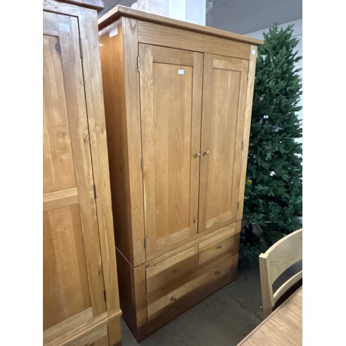 1571 - An oak double wardrobe