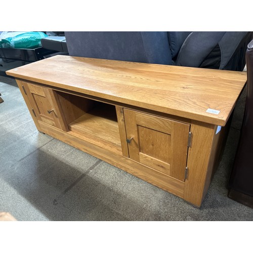 1583 - A large oak TV stand