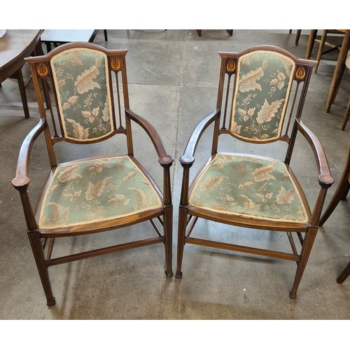 75A - A pair of Art Nouveau inlaid mahogany elbow chairs