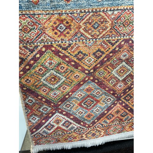 1590 - A multi coloured rug, 120 x 170cm