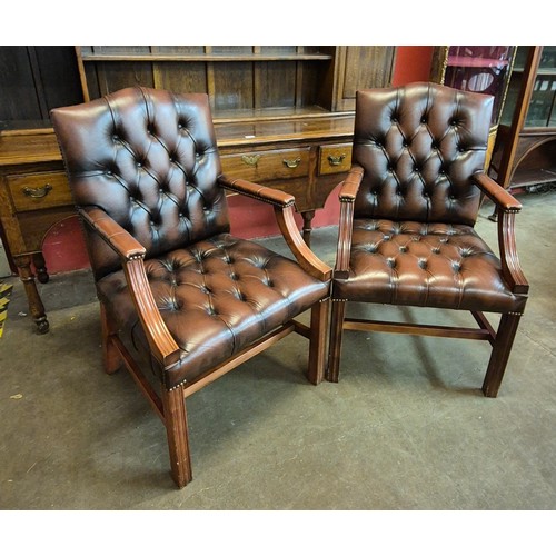 100A - A pair of mahogany and chestnut brown leather Gainsborough style chairs