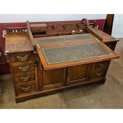 72 - A late Victorian oak tambour roll top bankers desk