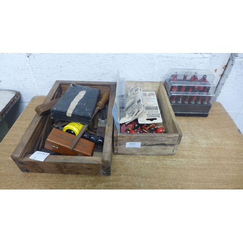 2015 - A box of vintage tools including pincers, a file, a micrometer, a box of router parts and jigsaw bla... 