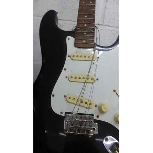 2073 - Three double cut Stratocaster style electric guitars including Black Knight, Rock Jam and Encore