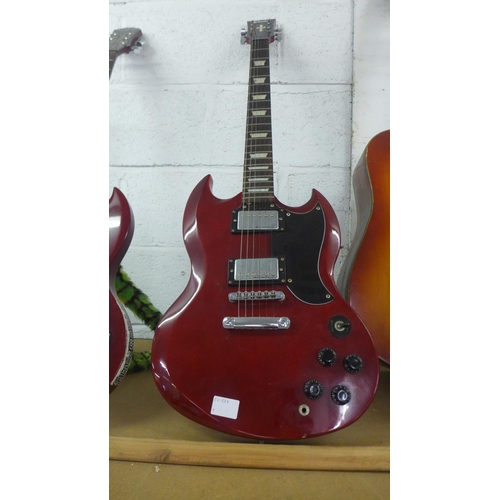 2075 - A cherry red SG style double cut Encore electric guitar
