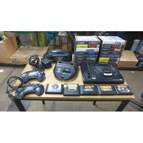 2123 - A Sega Mega Drive console with power and AV cables two control pads, Mega drive 32x convertor, maste... 