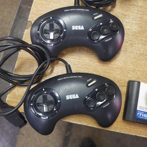 2123 - A Sega Mega Drive console with power and AV cables two control pads, Mega drive 32x convertor, maste... 