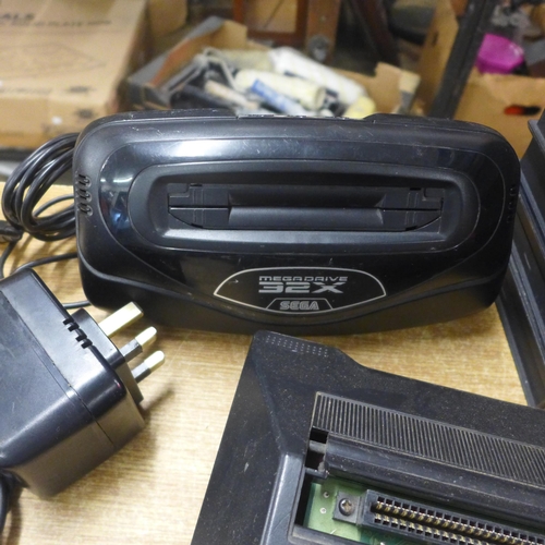 2123 - A Sega Mega Drive console with power and AV cables two control pads, Mega drive 32x convertor, maste... 