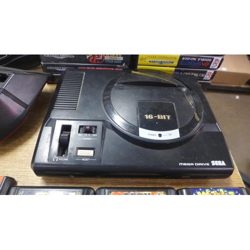 2123 - A Sega Mega Drive console with power and AV cables two control pads, Mega drive 32x convertor, maste... 