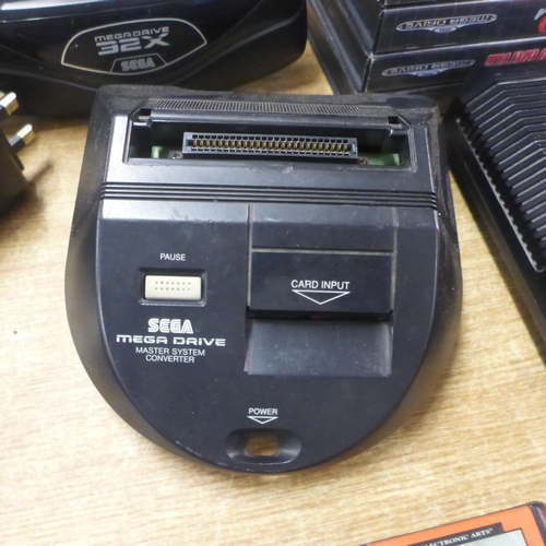 2123 - A Sega Mega Drive console with power and AV cables two control pads, Mega drive 32x convertor, maste... 