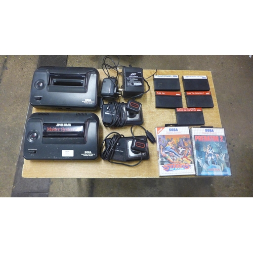 2124 - Two Sega Master System II power base consoles, with power cables, two Sega arcade Control joysticks ... 