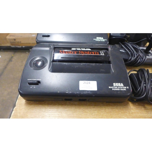 2124 - Two Sega Master System II power base consoles, with power cables, two Sega arcade Control joysticks ... 